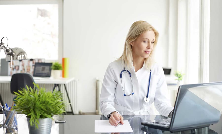 Female doctor on computer