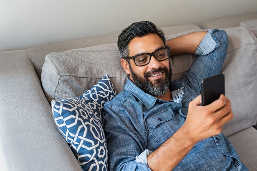 Man relaxing on his phone